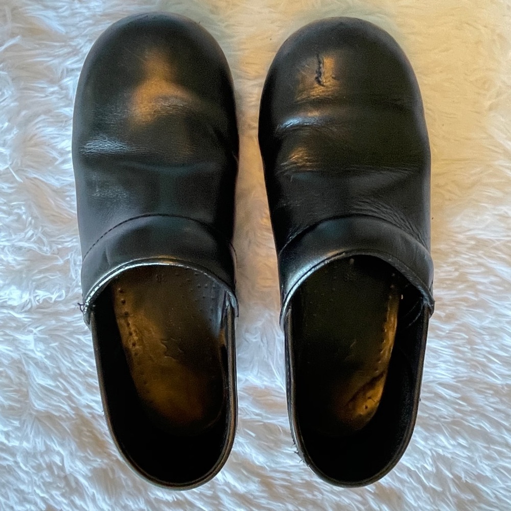 Dansko black leather clogs